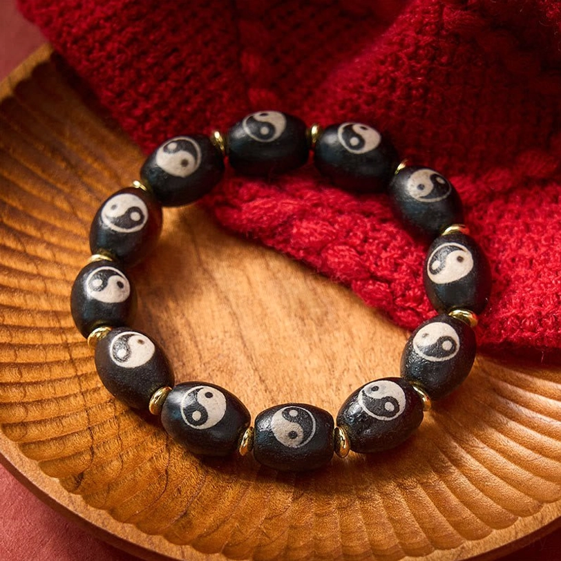 Tibetan Dzi Bead Yin Yang agate bracelet multiple variations display showing craftsmanship quality, bead finish, and design authenticity