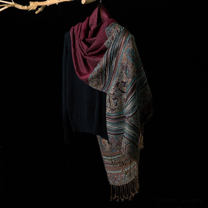 Tibetan handwoven tassel shawl side view with earth-toned geometric stripe pattern and matching tassel embellishment showing traditional weaving detail