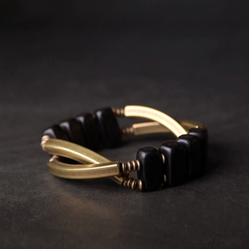 Tibetan ebony wood brass protection bracelet lifestyle wear, showing authentic handcrafted double layer design in everyday spiritual practice setting