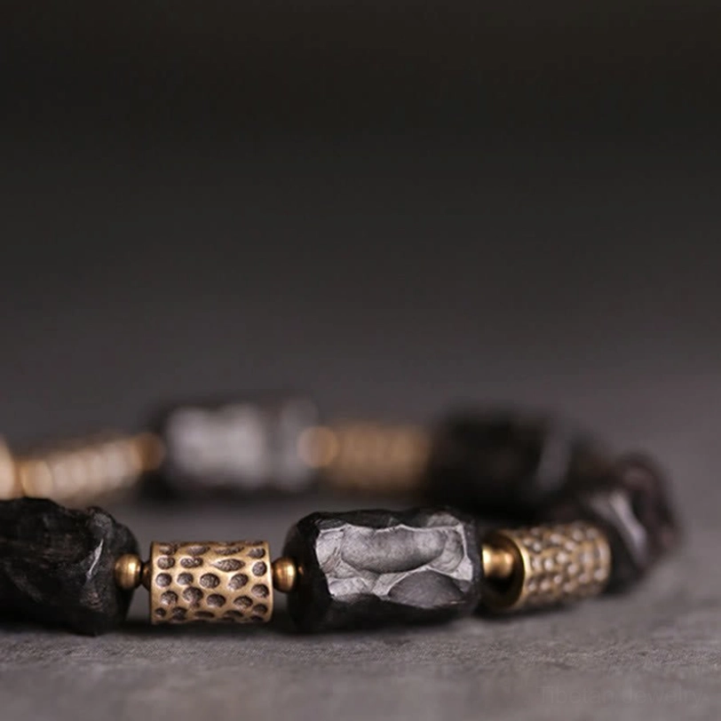 Tibetan ebony copper protection bracelet lifestyle image showing meaningful spiritual jewelry worn with intention