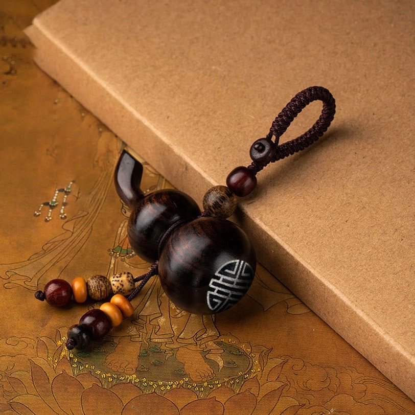 Ebony wood gourd keychain with decorative bead tassel, portable daily spiritual talisman for protection and positive energy meditation practice