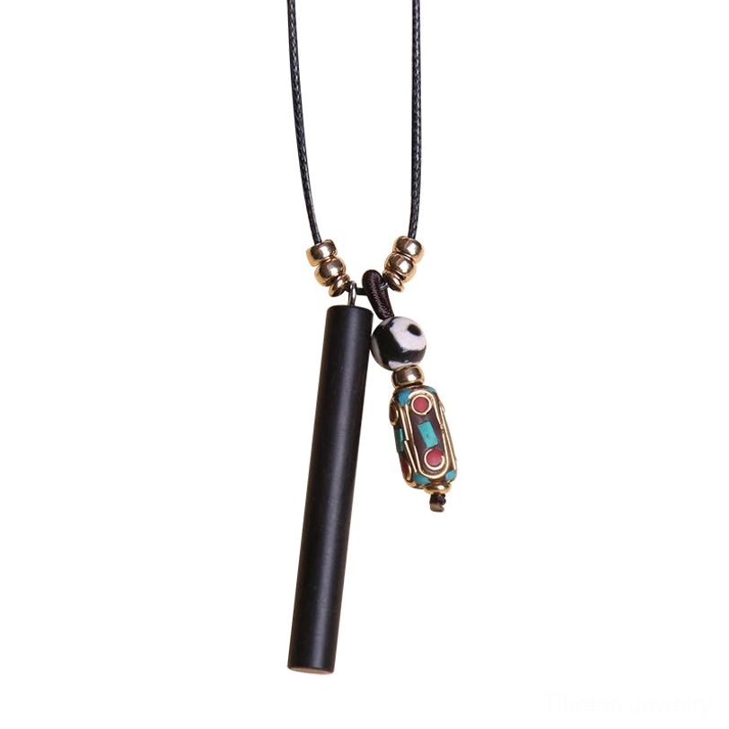 Tibetan dzi bead ebony wood pendant necklace hanging display on white background showing full length