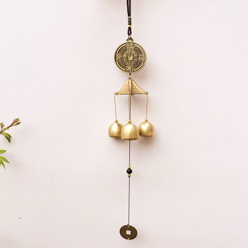 Tibetan elephant blessing wind chime hanging detail with bronze elephant medallion