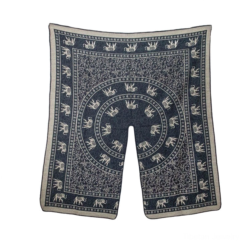 Dark navy blue Tibetan jacquard shawl flat lay showing elephant border and circular central motifs