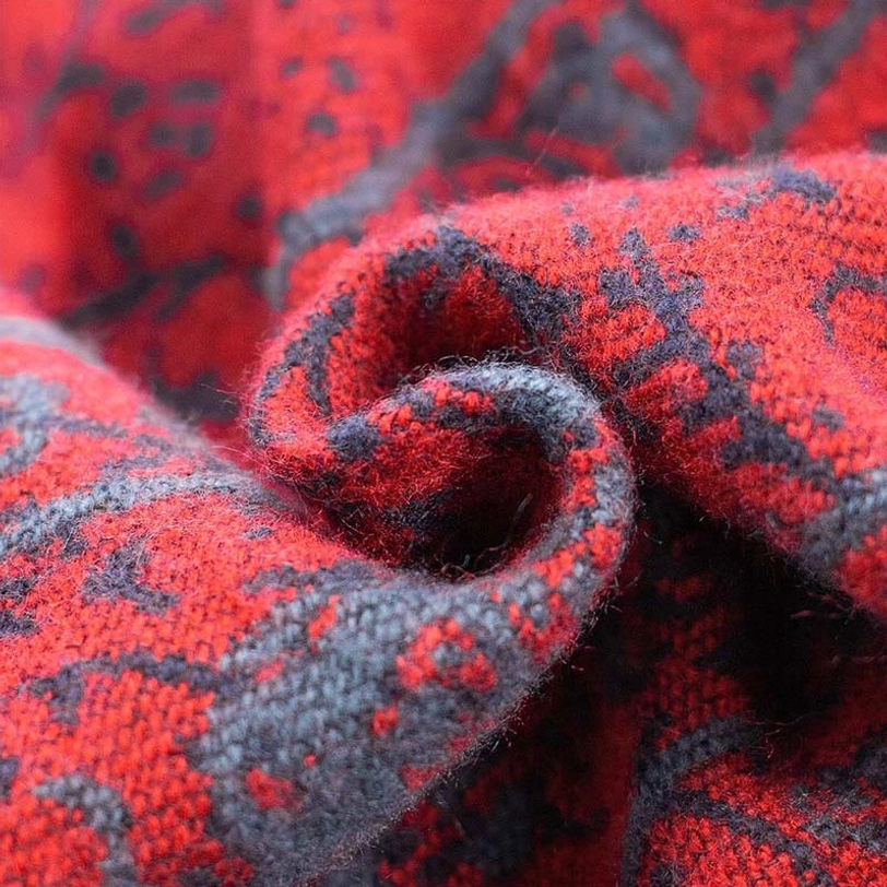 Draped Tibetan elephant jacquard shawl detail showing thick soft woven texture and red grey geometric patterns