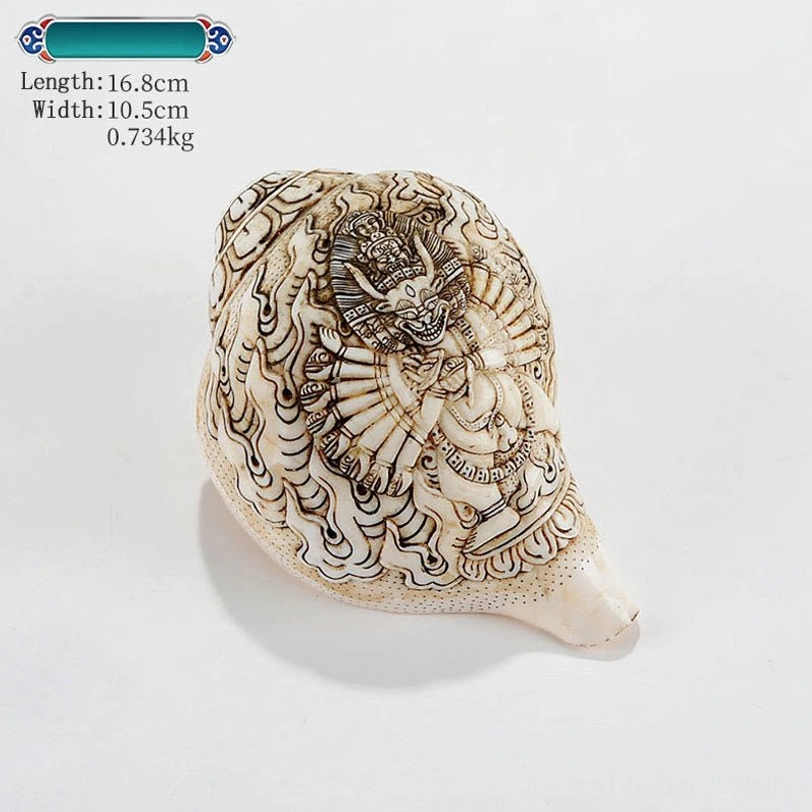 Pale cream shankha conch shell with intricate Tibetan Buddhist deity engraving and celestial cloud scrollwork