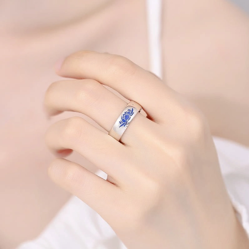 Tibetan blue lotus copper ring worn on index finger demonstrating comfortable fit and wearable design