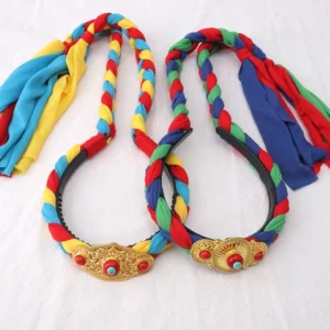 Handcrafted Tibetan hair decoration featuring red blue yellow braided threads and carved gold ornament with fabric tassels