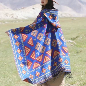 Bright blue Tibetan woven travel wrap with ethnic geometric patterns and tassel trims, side rear view