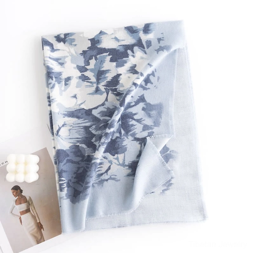 Blue and white floral print Tibetan scarf wrap displayed flat on white background showcasing oversized abstract ethnic print design