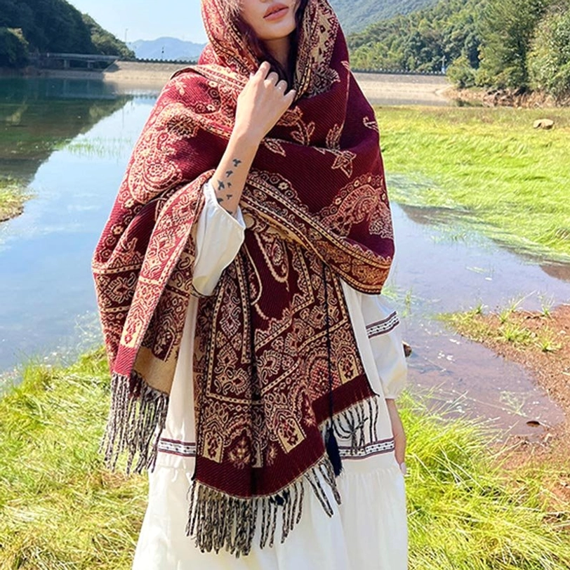 Dark red Tibetan ethnic shawl with intricate leaf patterns and tassel hem detail