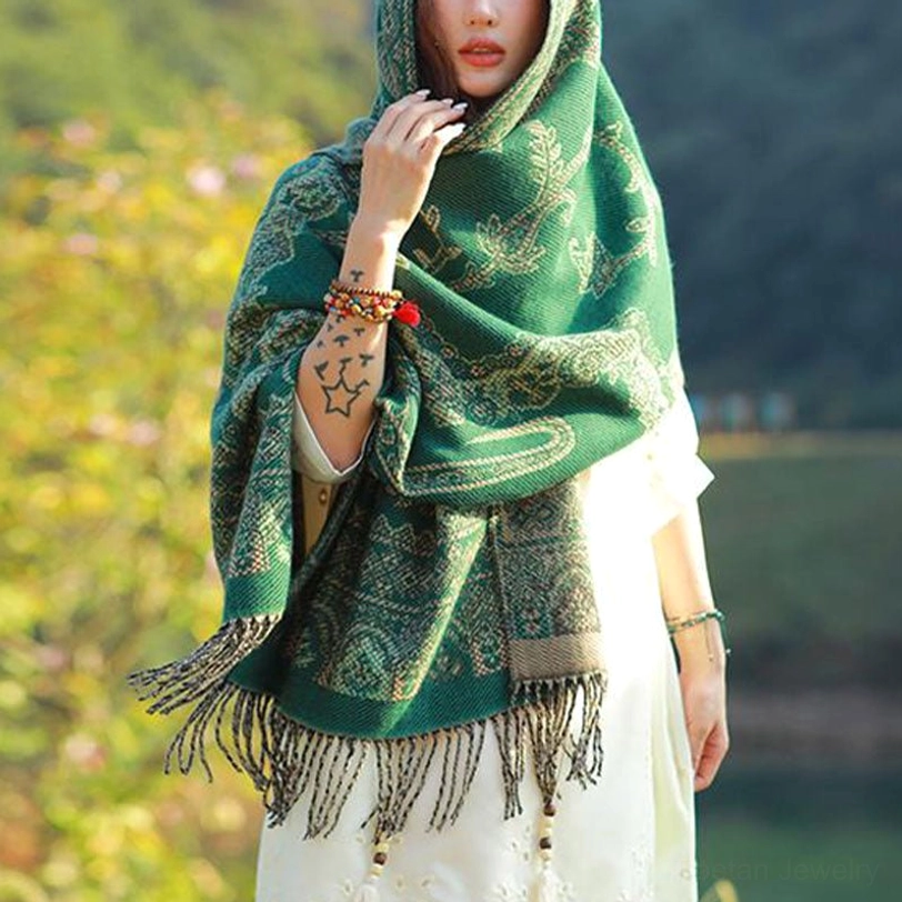 Tibetan shawl worn as evening wrap over formal attire, elegant draping