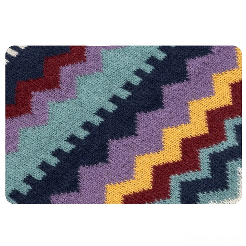 Tibetan ethnic shawl with colorful striped design, ruffled flounce hem and decorative tassel trim for travel and warmth