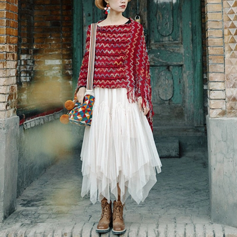 Tibetan ethnic tassel shawl showing asymmetric fringe details and multicolor woven texture