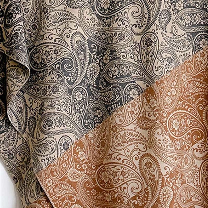 Tibetan ethnic wrap featuring handwoven paisley pattern, demonstrating authentic artisanal craftsmanship and cultural heritage