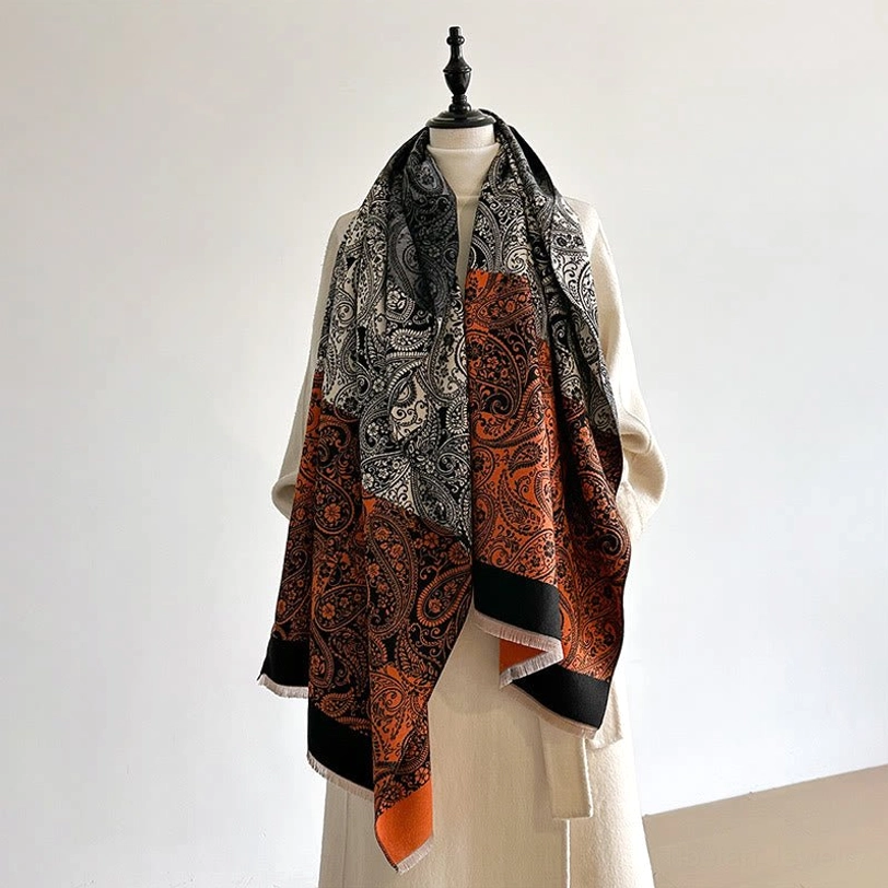 Ethnic Tibetan wrap on dress form featuring grey-orange-brown color blocking with paisley pattern and contrast hem