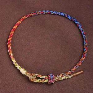 Handcrafted five-color Tibetan protection bracelet with multicolor braided rope and adjustable knot clasp, top-down view
