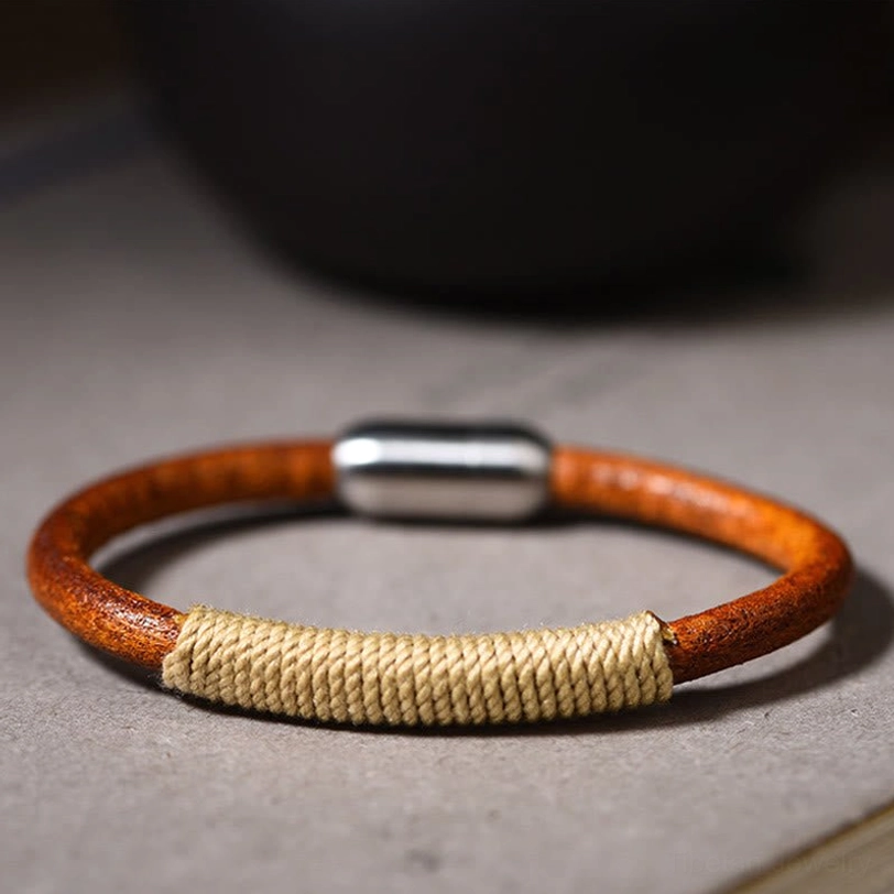 Tibetan five elements leather bracelet in beige metal color with silver magnetic clasp - flat lay top view