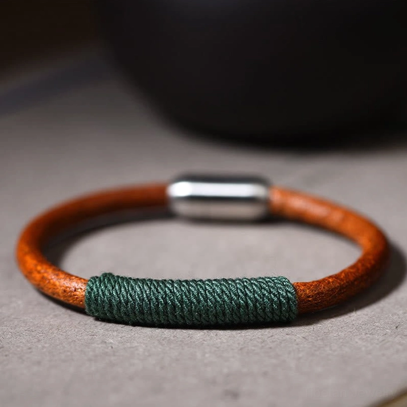 Single Tibetan five elements leather bracelet with green woven detail and silver magnetic clasp - top view