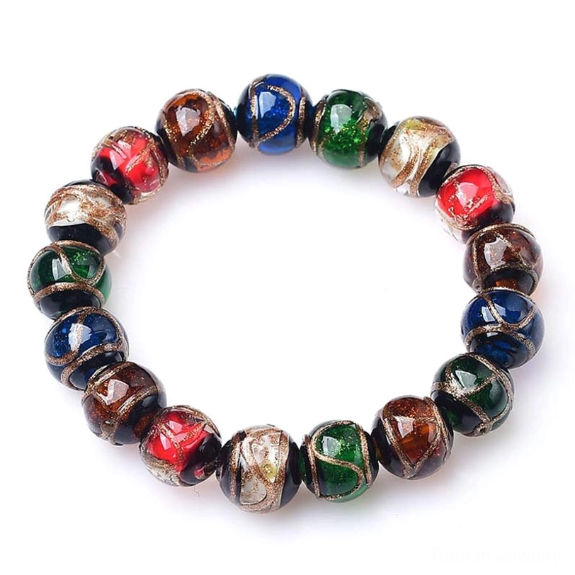 Single Tibetan incense ash liuli glass bead bracelet with full circular multicolor beads and metallic accents on solid dark blue background
