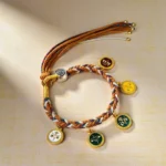 Handmade Tibetan five gods of wealth braided bracelet with multicolored rope and enamel charms displayed on beige linen