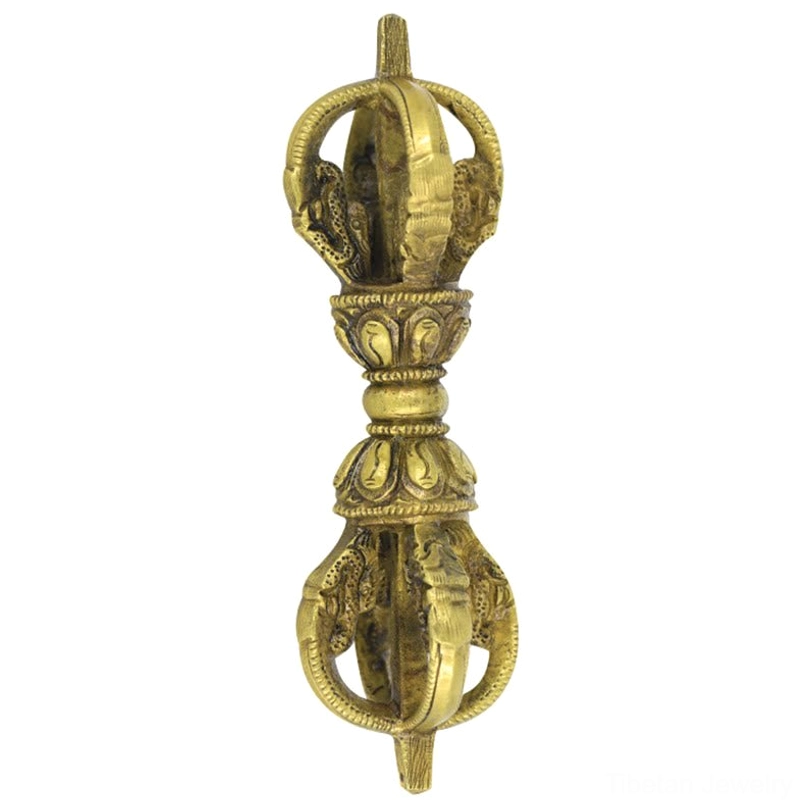 Front direct view of five-prong tibetan vajra dorje ritual object on neutral light background, displaying symmetrical religious structure and aged bronze copper texture finish