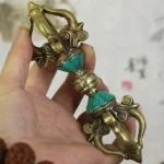 Tibetan five-prong vajra dorje handcrafted copper held in hand with turquoise inlay details