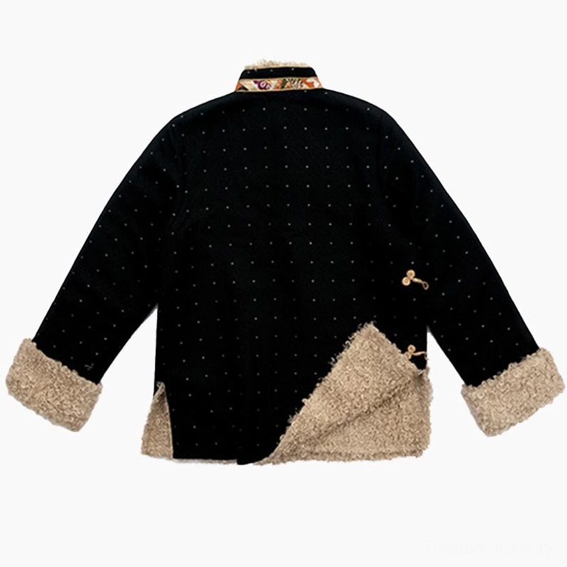 Back view of Tibetan winter top showing asymmetric fleece patch hem and small golden decorative button detail