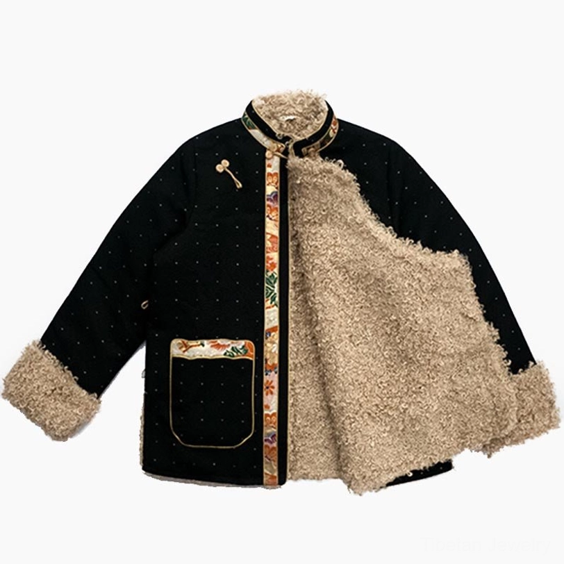 Tibetan fleece-lined top partially unbuttoned to reveal thick beige fleece inner lining and decorative ethnic pocket detail