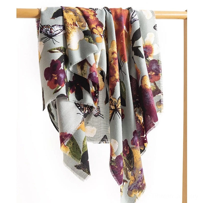 Full view Tibetan butterfly floral print shawl hung on minimalist rack displaying complete pattern