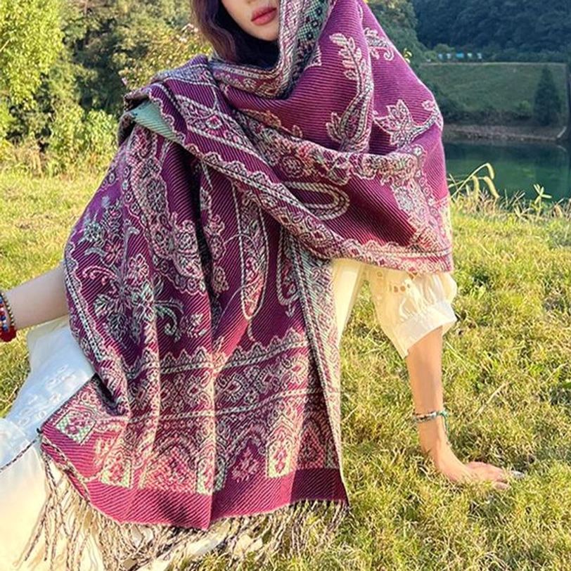 Deep pink Tibetan shawl with dense traditional leaf and floral patterns, worn as hood wrap