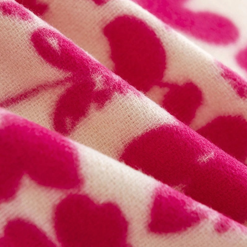 Detailed close-up of tibetan flower print shawl showing clear floral patterns and dense woven fabric