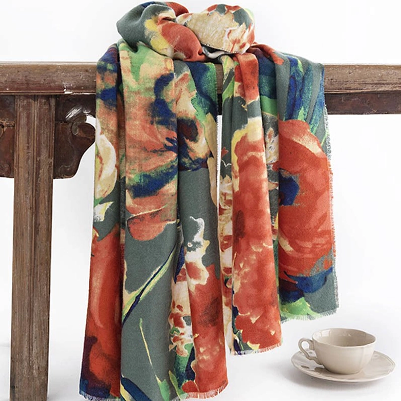 Tibetan retro floral printed scarf neatly draped on wooden rail with mixed rust green blue and cream tone design