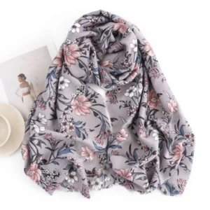 Tibetan floral scarf flat lay overhead view, retro camellia flower print on grey base with minimalist home decor background