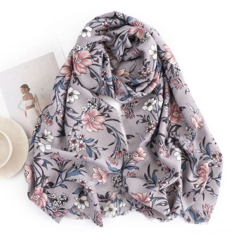 Tibetan floral scarf flat lay overhead view, retro camellia flower print on grey base with minimalist home decor background
