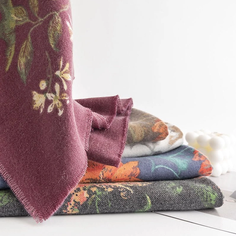 Tibetan scarf displayed as cozy home throw showing layered fabric texture and intricate floral botanical print design