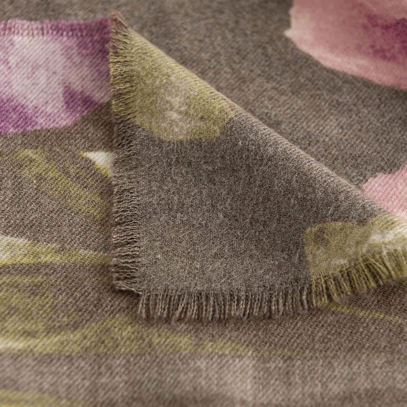 Layered styling of Tibetan floral scarf over casual clothing showing versatile wear options