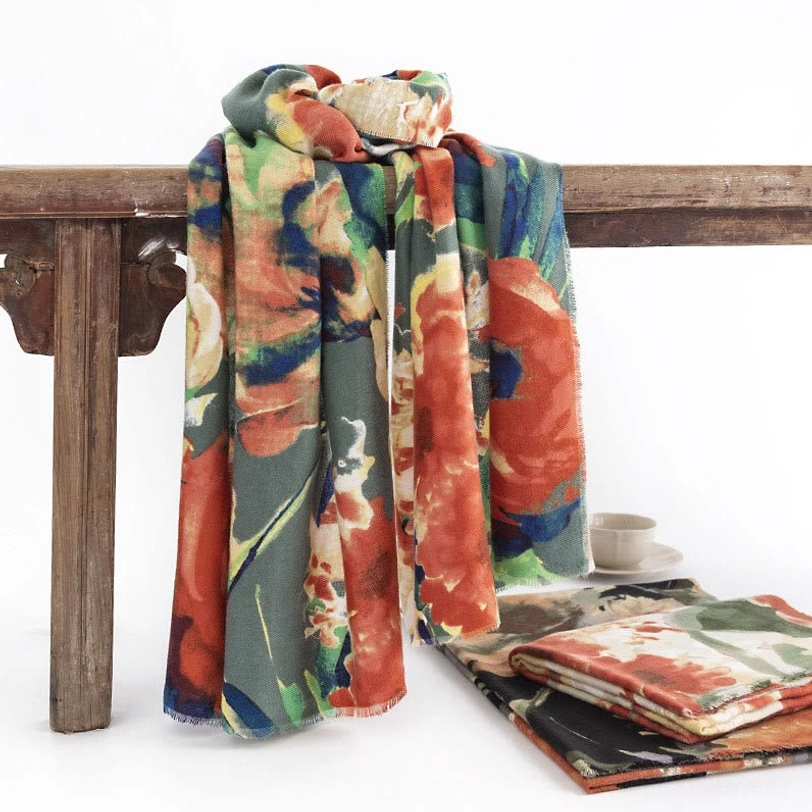 Tibetan ink floral printed scarf draped on wooden railing with vintage retro watercolor flower design in multi-color earth tones