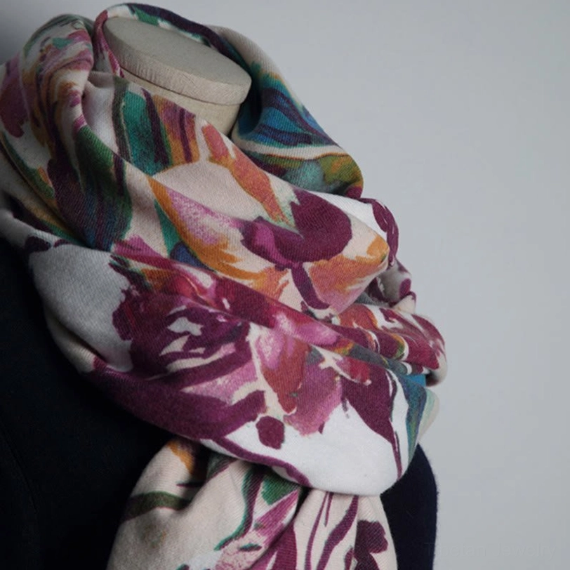 Oblique close-up of draped Tibetan shawl highlighting rich color palette of watercolor floral design
