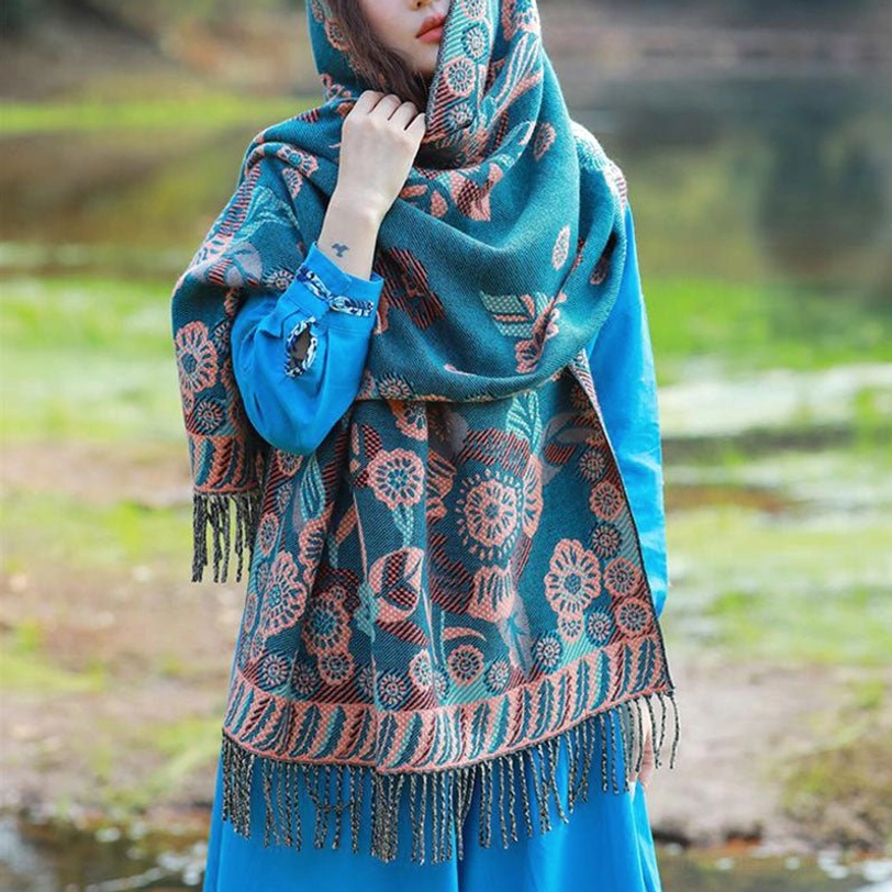Hooded Tibetan botanical shawl with warm fabric and vivid floral prints outdoors