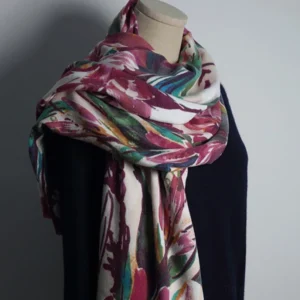 Tibetan watercolor floral print shawl worn on mannequin, featuring wine red, green, and blue flowers on soft drape fabric