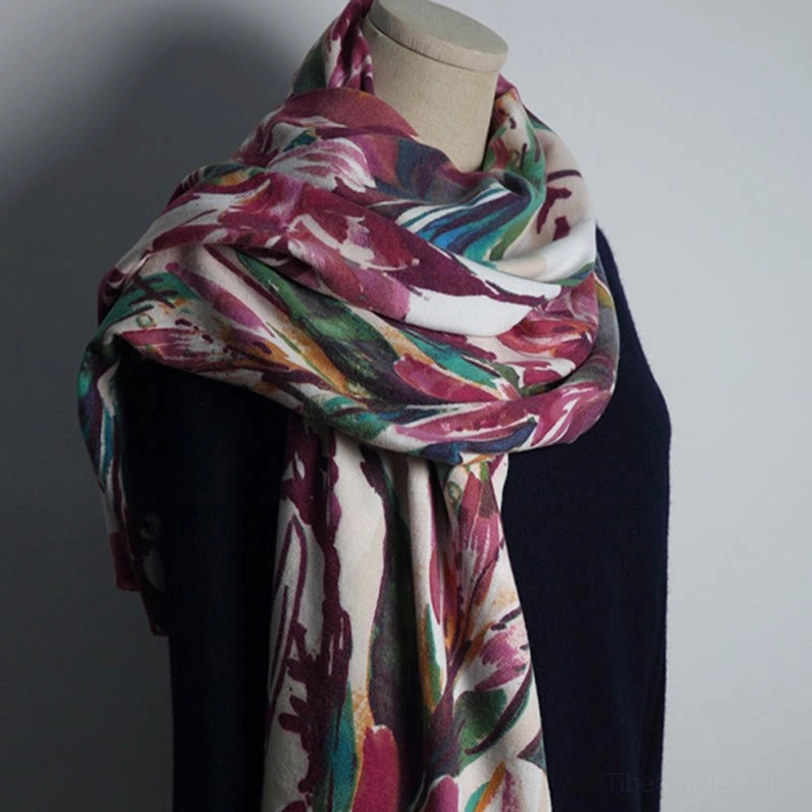 Tibetan watercolor floral print shawl worn on mannequin, featuring wine red, green, and blue flowers on soft drape fabric