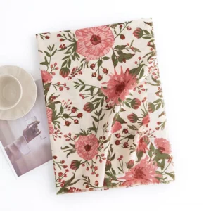 Flat lay view of Tibetan scarf wrap showing complete floral pattern with coffee cup and magazine, romantic botanical design on beige base