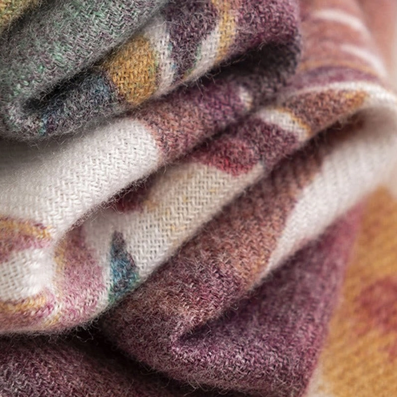 Tibetan watercolor scarf presented in lifestyle setting demonstrating everyday wearability and style