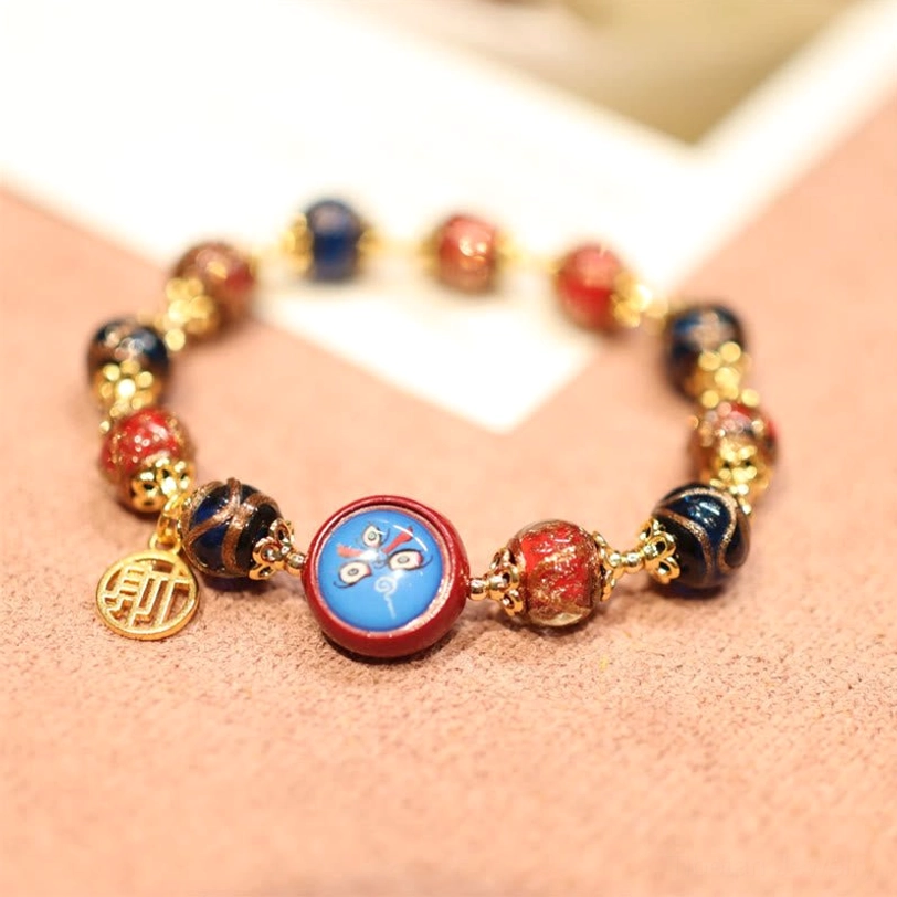 Tibetan fortune bead bracelet with enamel round fortune motif, Chinese charm tag and mixed colored beads