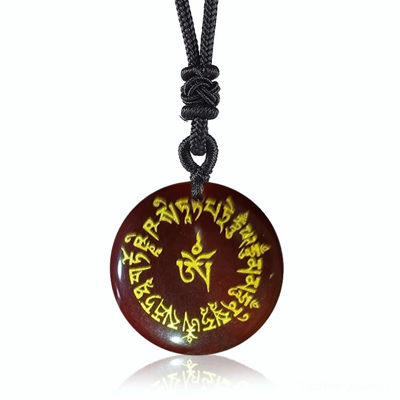 Red Agate Tibetan Fortune Mantra pendant with polished red stone and hand-engraved sacred mantras