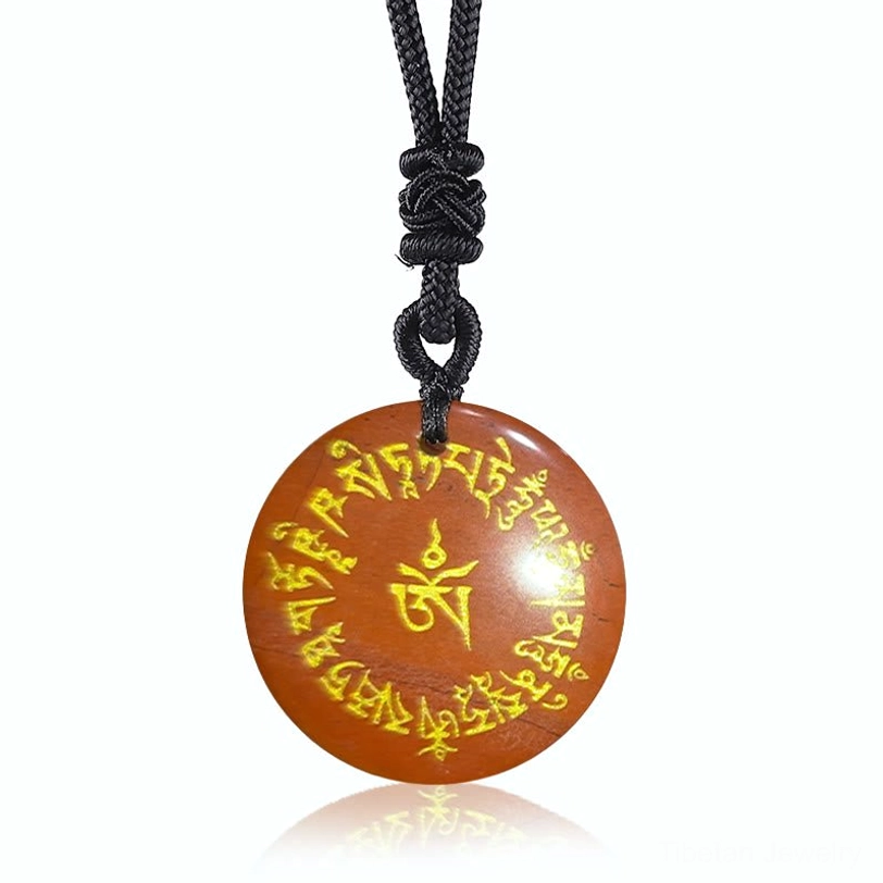 Red Jasper Tibetan mantra pendant with deep red stone and gold-engraved Sanskrit fortune-gathering mantras