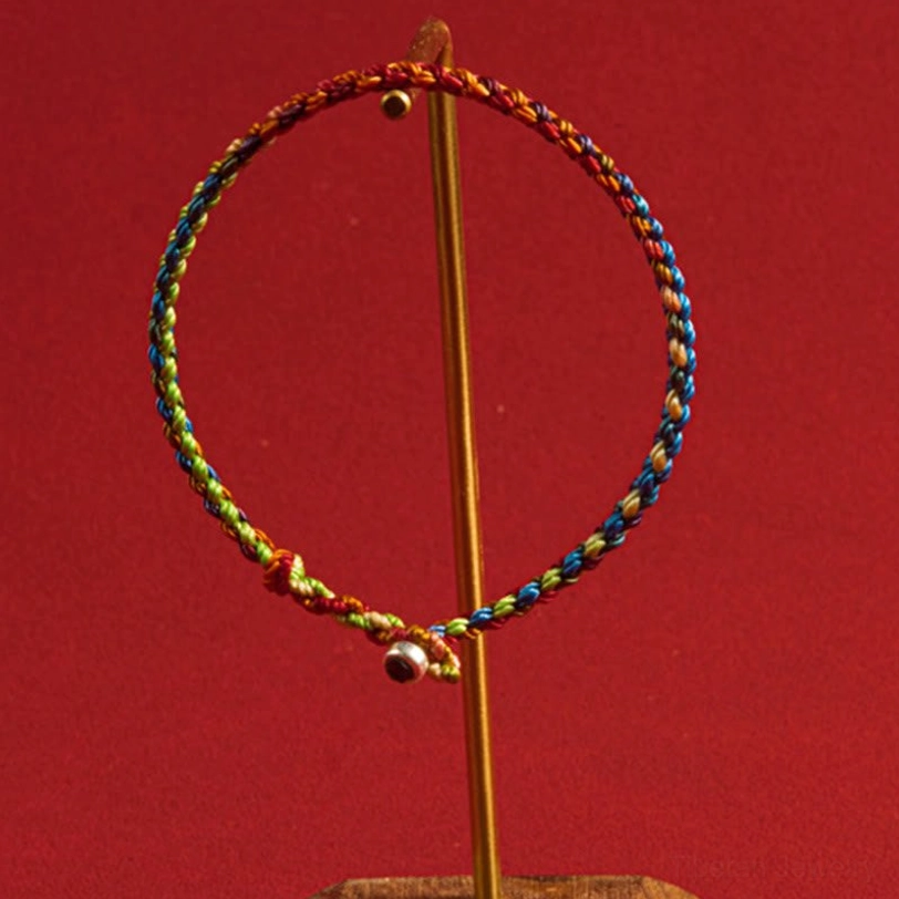 Tibetan four seasons protection bracelet multicolored woven cord with silver detail