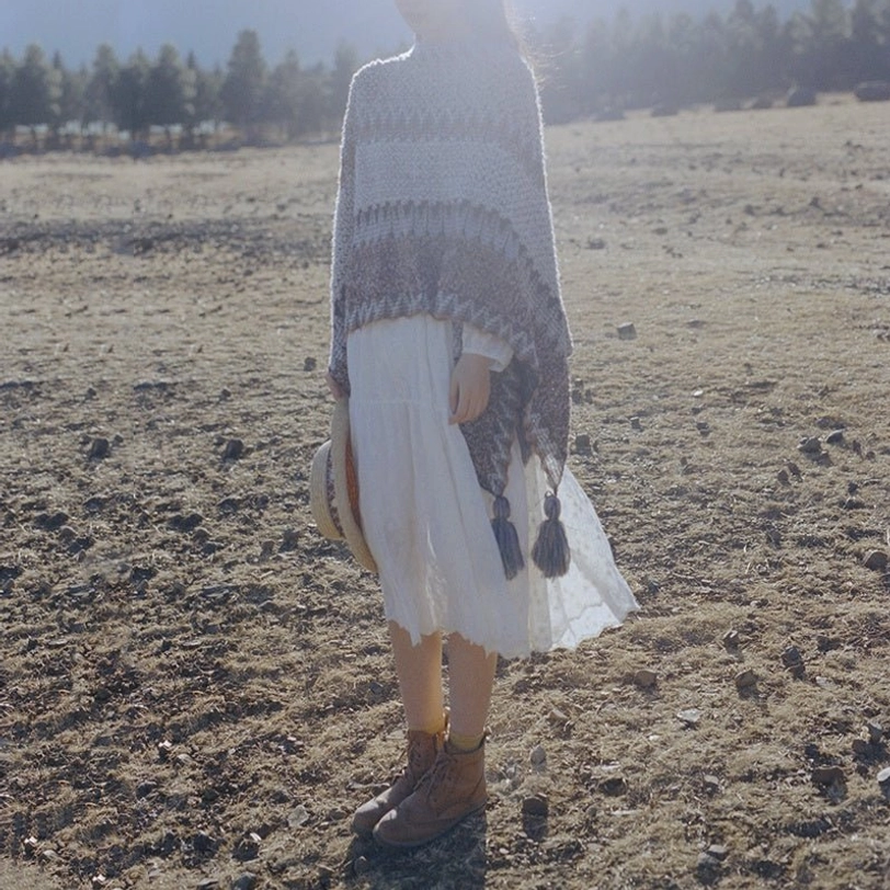 Tibetan geometric striped knit shawl with decorative tassels displayed flat showing full dimensions and pattern clarity