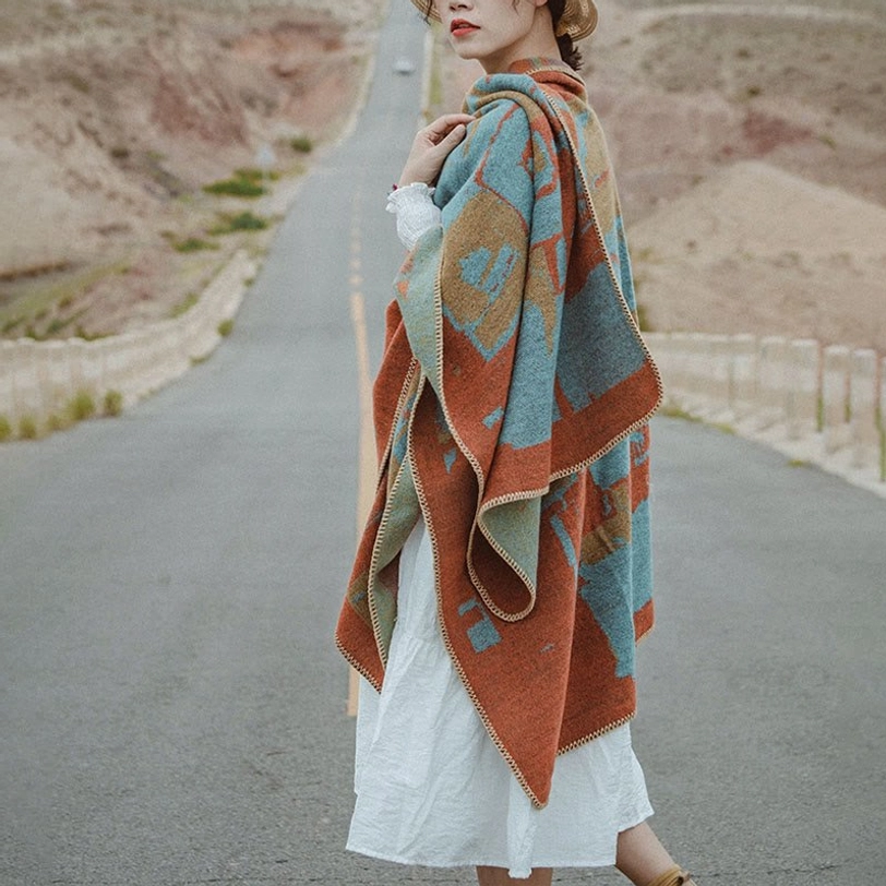 Bohemian orange knitted poncho shawl side profile with desert highway backdrop